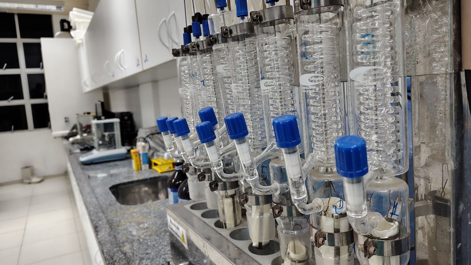 A bank of glass condensers set up for reflux and distillation work