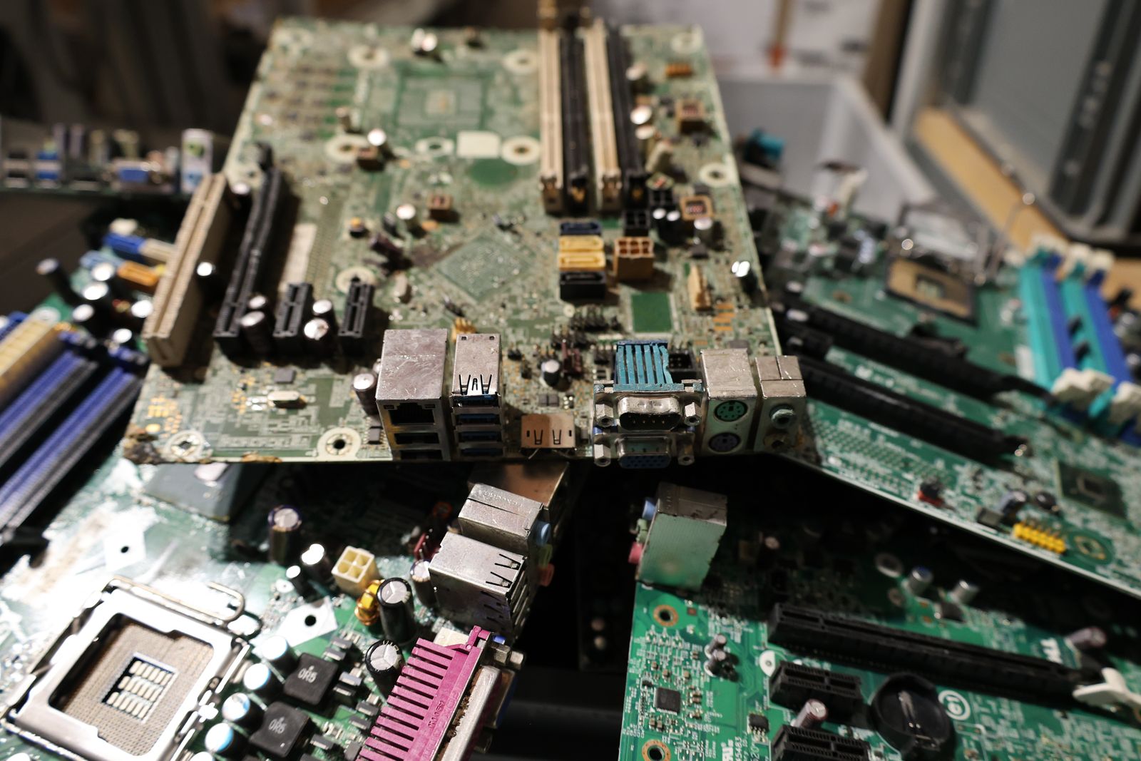 Stacked scrap circuit boards with soldered connectors and components