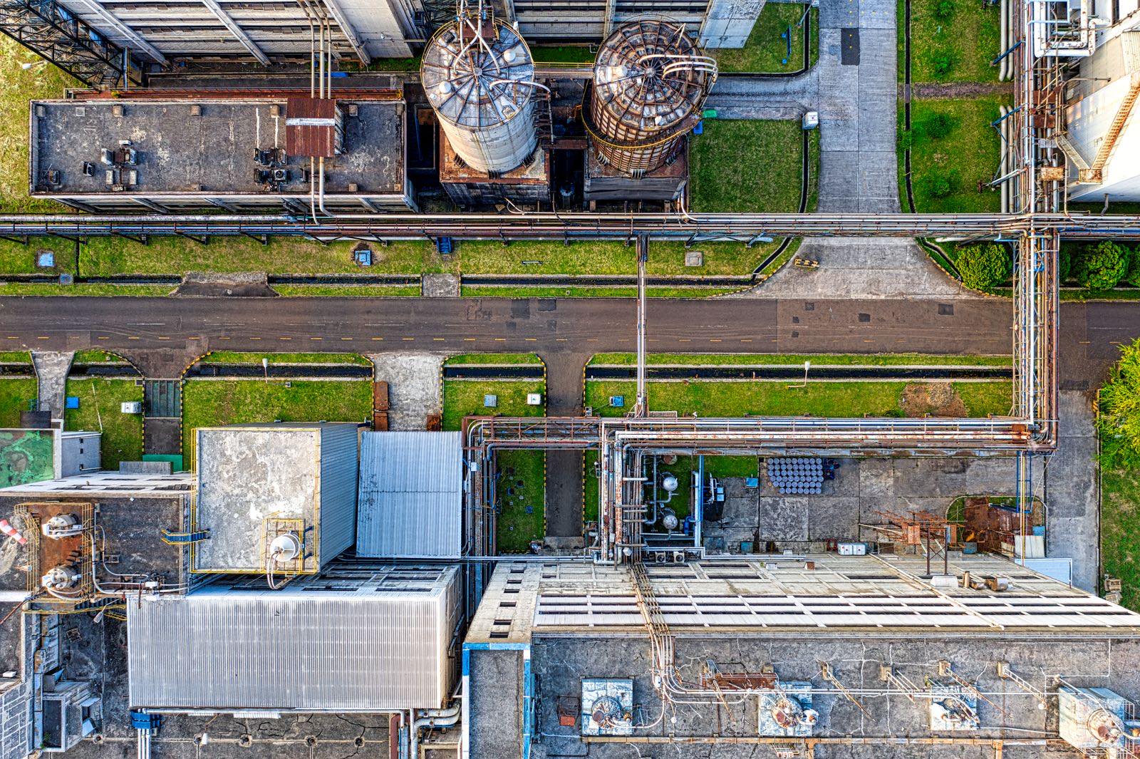 Process units, pipe racks and cooling towers at a chemical plant seen from directly above